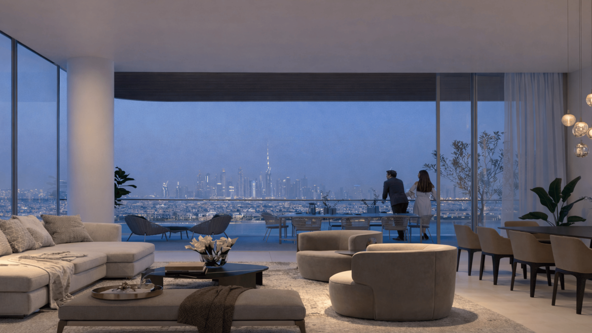 Interior view of a luxury Dubai apartment with floor-to-ceiling windows overlooking the waterfront, illustrating the type of ready property where buyers will pay DEWA and district cooling setup costs.